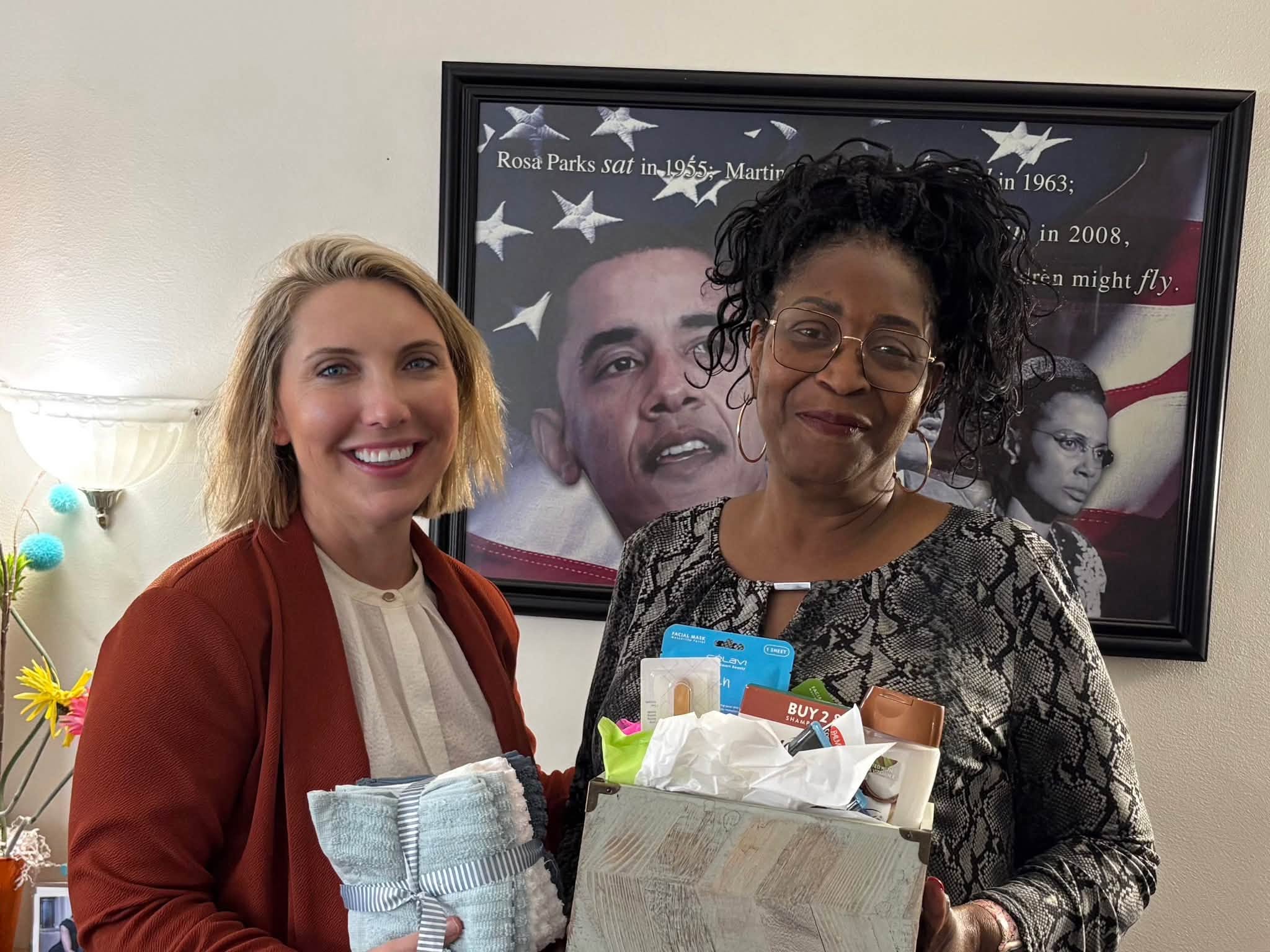 Ericka McCauley handing a care package to a neighbor