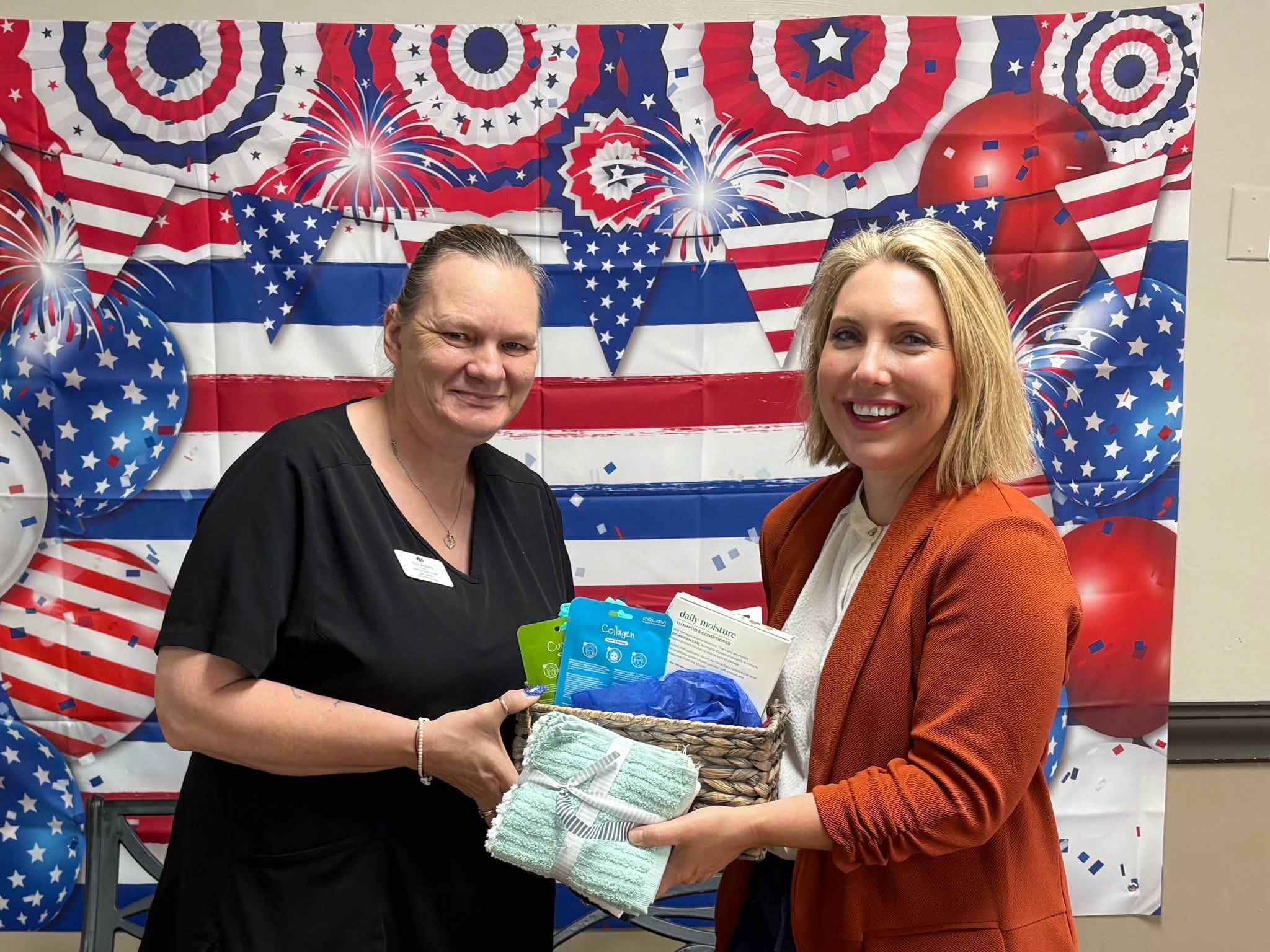 Ericka McCauley handing a care package to a Hobart Township resident